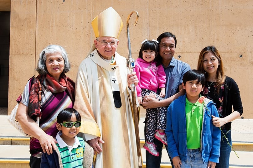 Archbishop José Gomez of Los Angeles pictured with a family outside the Cathedral of Our Lady of the Angels, Los Angeles. Photo: Archdiocese of Los Angeles