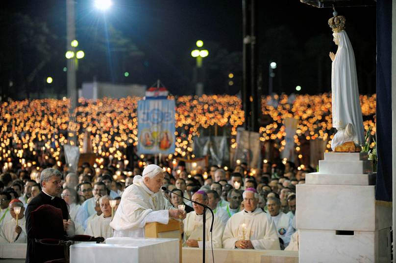 Pope Benedict XVI prays in front of a statue of Our Lady of Fatima during a candlelight vigil at the Marian shrine of Fatima in central Portugal in May 2010. Controversy has erupted again recently over the Third Secret of Fatima. Photo: L’Osservatore Romano 