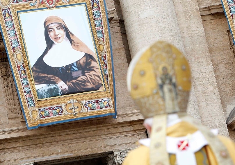 A tapestry showing St Mary MacKillop, Australia's first saint, is seen as Pope Benedict XVI celebrates a Mass of canonisation in St Peter's Square on 17 October, 2010. Photo: CNS/Tony Gentile, Reuters 