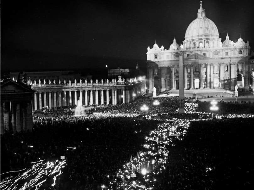 A candlelit gathering is held in St Peter's Square following the opening session of the Second Vatican Council on 11 October, 1962. The council's four sessions and its 16 landmark documents modernised the liturgy, renewed the priesthood and religious life, enhanced the role of lay Catholics, and opened dialogue with other churches and non-Christians. Photo: CNS//L'Osservatore Romano