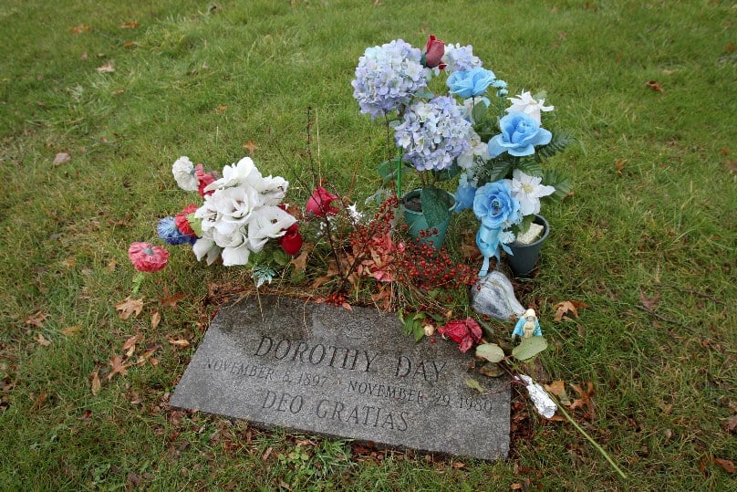 Flowers decorate the grave of Dorothy Day, co-founder of the Catholic Worker movement, at Cemetery of the Resurrection in New York in this 2012 file photo. Photo: CNS/Gregory A. Shemitz