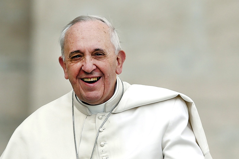 Pope Francis smiles as he arrives to lead his general audience in St Peter's Square, Rome, on 19 February. Photo: CNS