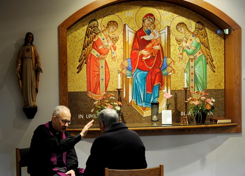 An American priest hears a confession in 2013. Photo: CNS/Mike Crupi, Catholic Courier