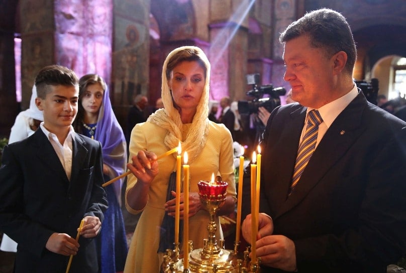 Ukraine’s President Petro Poroshenko, his wife Maryna and son Mykhailo, attend a service in Kiev’s St Sofia Cathedral (Orthodox) in 2014. Photos: CNS