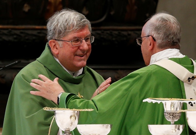 Pope Francis exchanges the sign of peace with Cardinal Thomas Collins of Toronto during a Mass of thanksgiving in St Peter's Basilica at the Vatican in 2014. Photo: CNS photo/Paul Haring