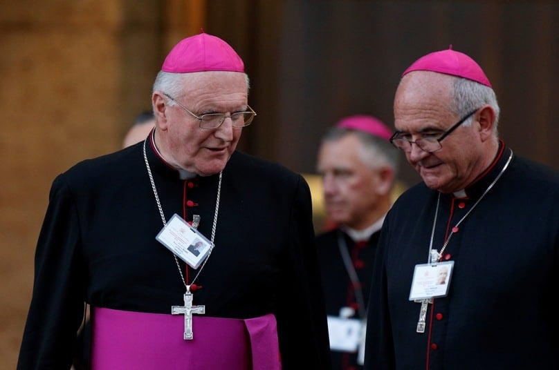 Archbishops Denis Hart of Melbourne and Stephen Brislin of Cape Town, South Africa, leave the concluding session of the extraordinary Synod of Bishops on the family at the Vatican on 18 October, 2014. Photo: CNS/Paul Haring