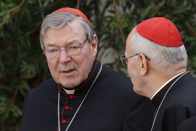 Cardinal George Pell, prefect of the Vatican Secretariat for the Economy, talks with Cardinal Peter Erdo of Esztergom-Budapest, Hungary, on 13 October, 2014. Photo: CNS photoPaul Haring.