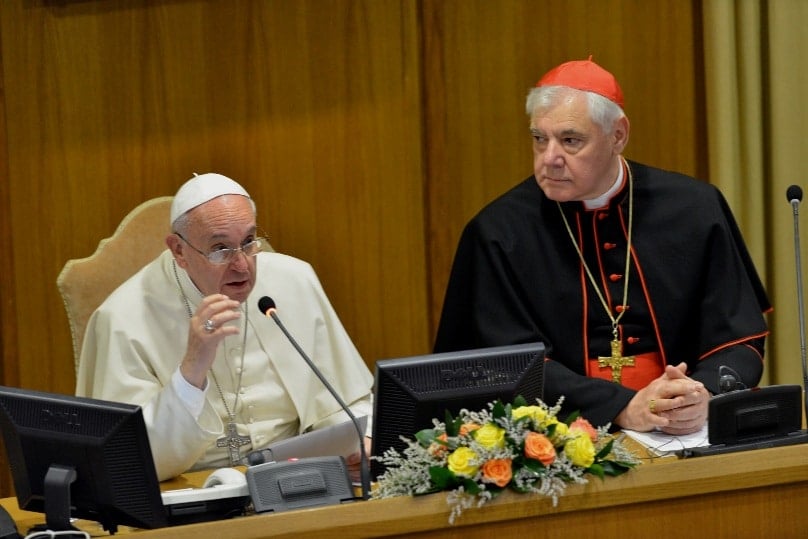 Pope Francis, seated next to Cardinal Gerhard Muller, prefect of the Vatican Congregation for the Doctrine of the Faith, discusses preservation of the family in Synod Hall at the Vatican in November 2014 during the opening of a three-day interreligious conference on traditional marriage. Photo: CNS/Chris Warde-Jones, courtesy Humanum.it