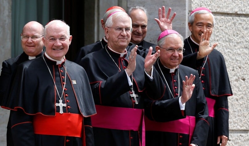 Cardinal Mark Ouellet (second from left) and other cardinals and bishops wave as Pope Francis leaves in his car after celebrating Mass at the Pontifical North American College in Rome on 2 May. Photo: CNS/Paul Haring.