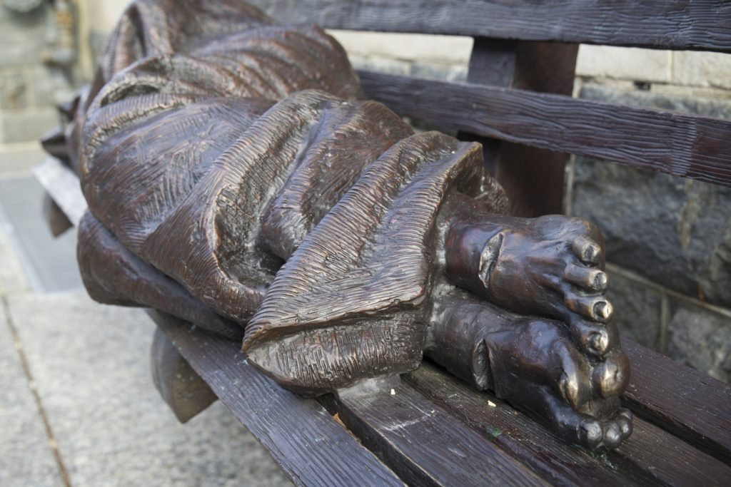 'Homeless Jesus' is pictured in this July photo of the bronze sculpture that sits in front of a downtown Washington building occupied by Catholic Charities of the archdiocese of Washington. Photo: CNS/Chaz Muth