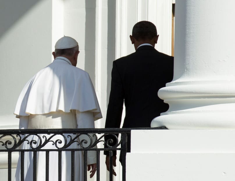 U.S. President Barack Obama and Pope Francis walk together at the end of an arrival ceremony on the South Lawn of the White House in Washington in September 2015. Photo: CNS/Joshua Roberts