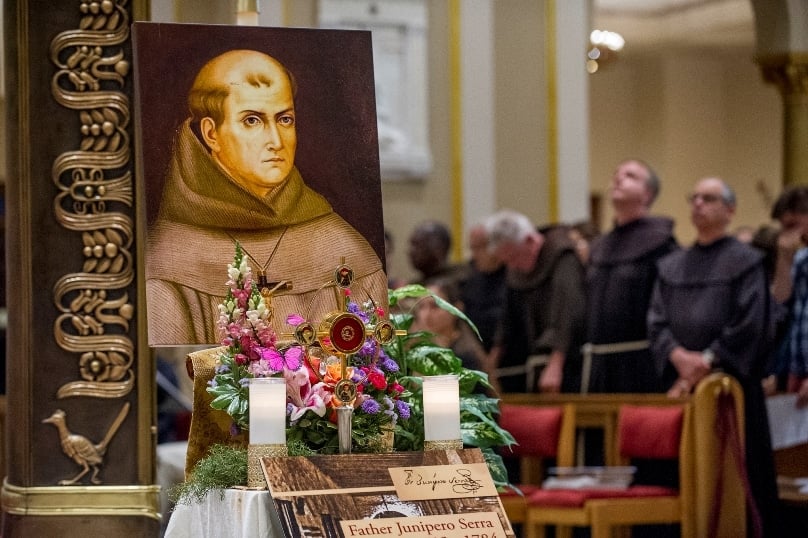 An image of St Junipero Serra is displayed as Franciscans celebrate his canonisation with a Mass of thanksgiving at the Franciscan Monastery in Washington on 24 September. Photo: CNS/Karen Kasmauski