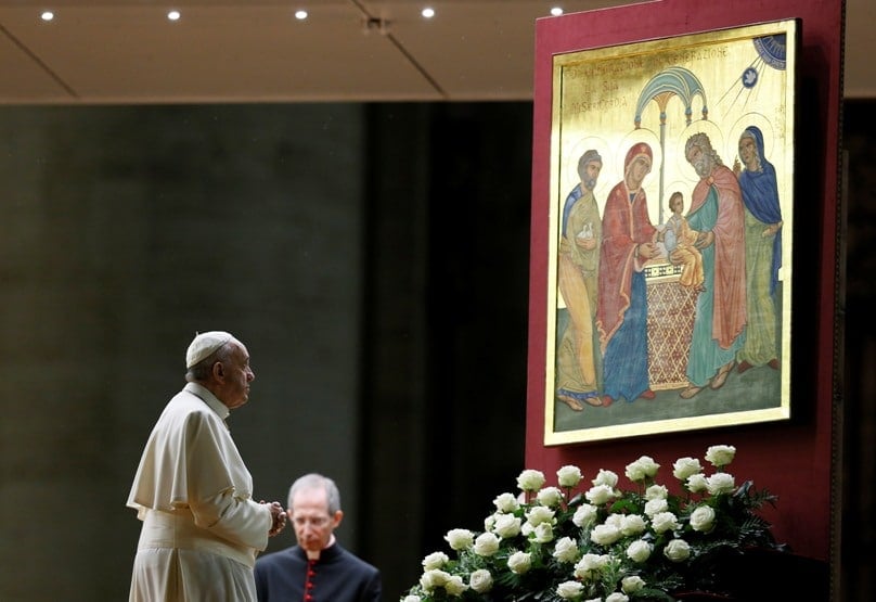 Pope Francis prays in front of an image of the Holy Family during a prayer vigil for the Synod of Bishops on the family in St Peter's Basilica at the Vatican on 3 October. Photo: CNS/Paul Haring