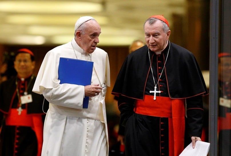 Pope Francis and Cardinal Pietro Parolin, Vatican secretary of state, talk as they leave the opening session of the Synod of Bishops on the family at the Vatican on 5 October. Photo: Paul Haring/CNS