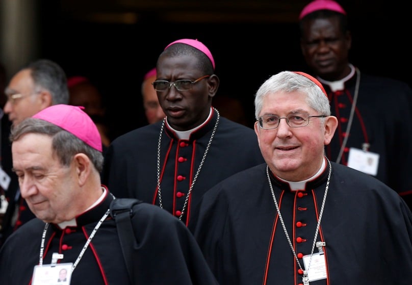 Cardinal Thomas Collins of Toronto, right, leaves a session of the Synod of Bishops on the family at the Vatican on 9 October. Photo: CNS/Paul Haring