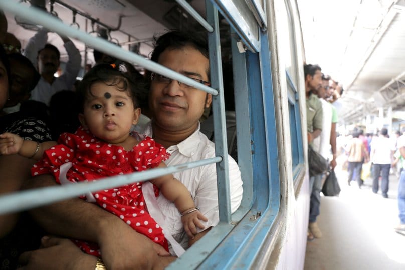 A family travels by train in Kolkata, India. Pope Francis announced that he is establishing a new office for laity, family and life, which combines the responsibilities of two pontifical councils. Photo: Piyal Adhikary, EPA