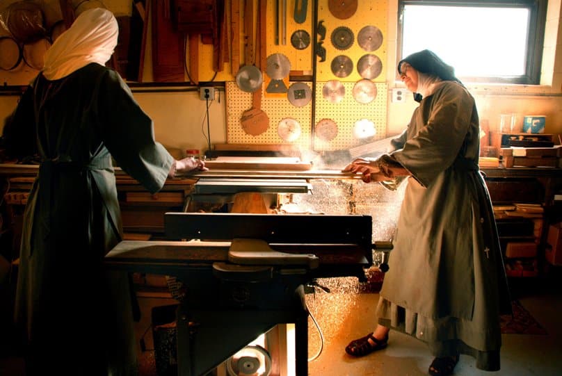 In this undated photo, a Poor Clare Colettine nun who is the novice mistress works with a novice in the wood shop at the religious order's Corpus Christi Monastery in the American state of Illinois. Photo: CNS/Abbie Reese
