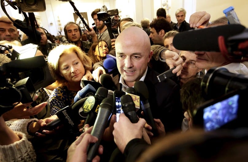 Italian journalist Gianluigi Nuzzi is surrounded by the media after a 4 November news conference for his new book. Photo: CNS/Yara Nardi, Reuters 