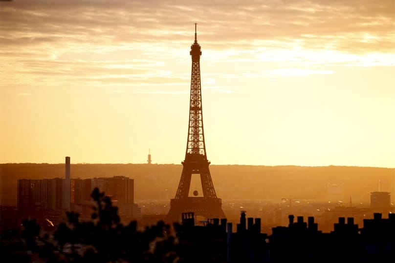 The Eiffel Tower is seen at sunset in Paris on 22 November. Catholic organizations said the terror attacks in Paris had not dissuaded them from attending the U.N. climate change conference in early December. Photo: CNS/Charles Platiau, Reuters