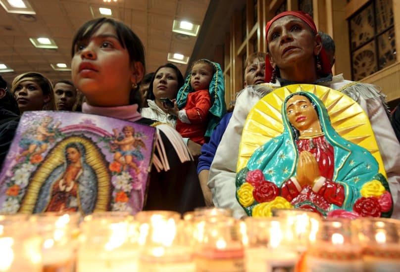 Pilgrims hold up images of Our Lady of Guadalupe during an annual pilgrimage in her honour at the cathedral in Ciudad Juarez, Mexico, on 11 December. The Vatican announced on 12 December that the pope will visit Mexico in February 2016. Photo: CNS/Jose Luis Gonzalez, Reuters