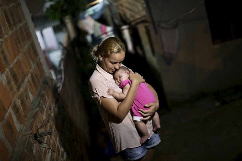 Gleyse Kelly da Silva poses for a photo last month with her daughter, Maria Giovanna, who has microcephaly, in Recife, Brazil. Photo: CNS/Ueslei Marcelino, Reuters