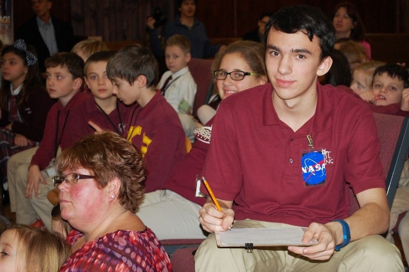 American student Michael Blais records information from the International Space Station during the February assembly. Photo: CNS/Cori Fugere Urban, Vermont Catholic