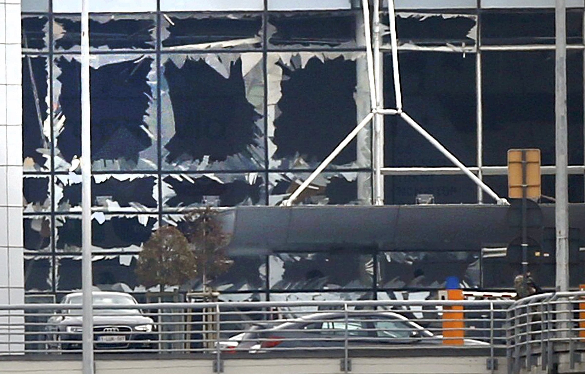 Broken windows are seen at the scene of explosions at Zaventem airport near Brussels. Photo: CNS/Francois Lenoir, Reuters