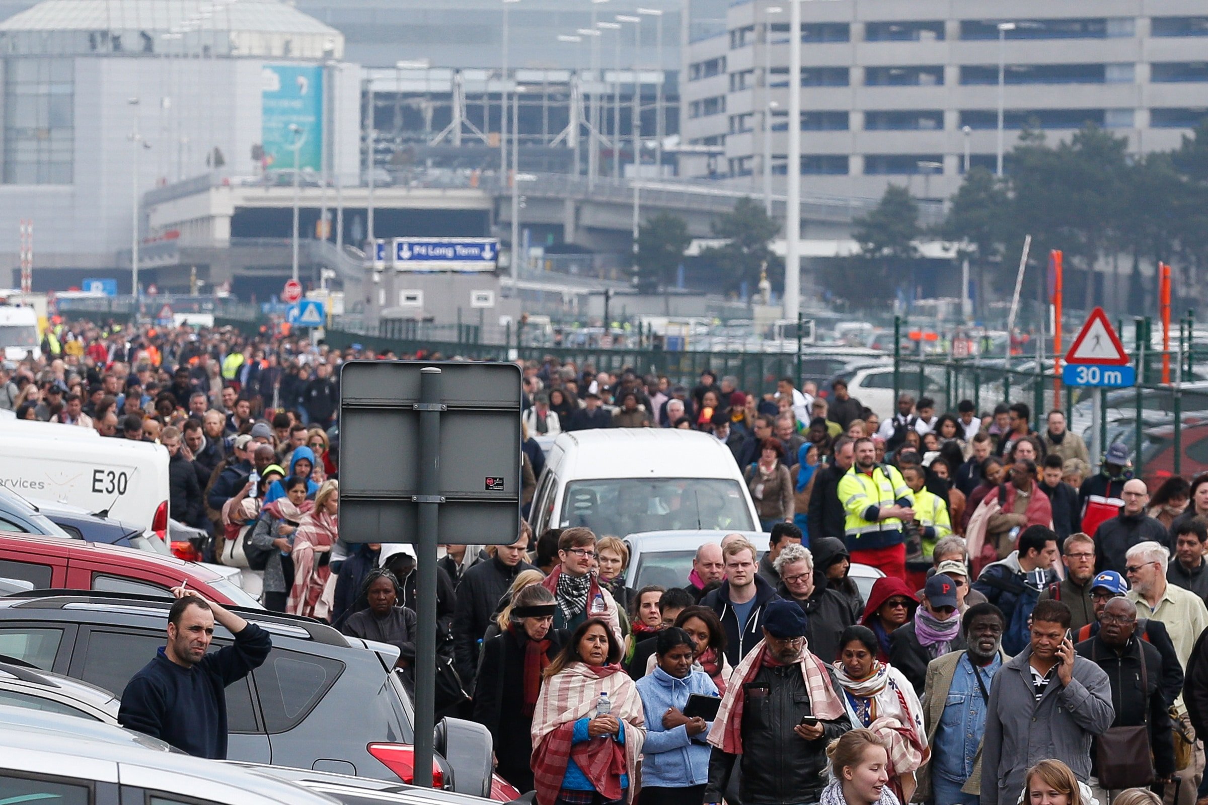People evacuate Zaventem airport after explosions near Brussels on 22 March. Photo: CNS/Laurent Dubrule, EPA