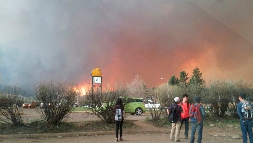 Students from Fort McMurray Composite High School are released early as a bushfire burns in nearby Fort McMurray in Alberta, Canada. Photo: CNS/Kangen Lee via Reuters