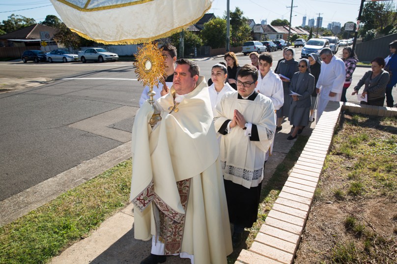 Fr Andrew Bass leading a parish Eucharistic procession in May. Photo: Raynard Tan
