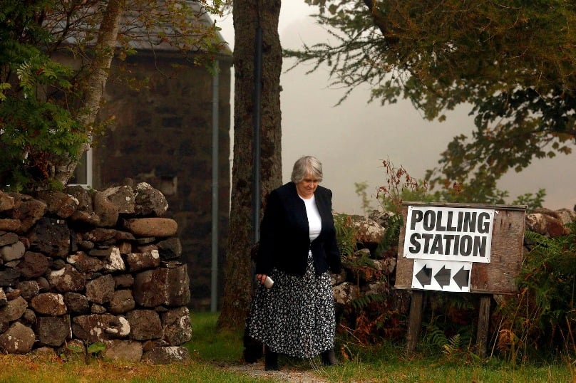 A voter leaves a polling station in 2014 in Portree, Scotland. That year Scots narrowly voted not to press ahead with national independence. Photo: CNS/Cathal McNaughton, Reuters