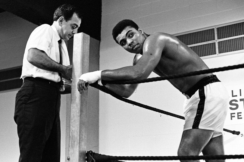 Boxing legend Muhammad Ali is seen in a 1967 photo with his trainer Angelo Dundee ahead of his fight with Ernie Terrell at the Astrodome in Houston. Photo: CNS/Action Images, MSI via Reuters