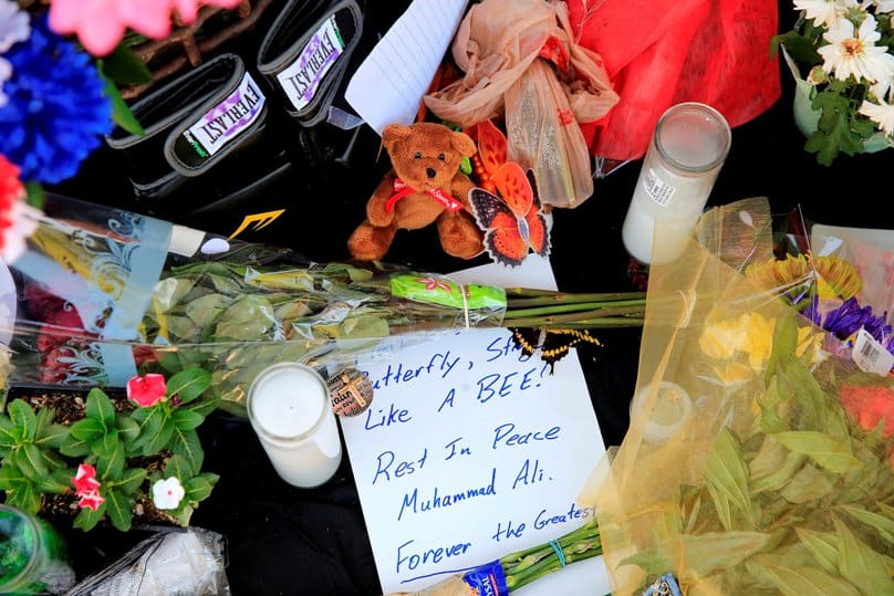 A handwritten note is among the tributes left at a pop-up memorial to Muhammad Ali on 5 June outside the Scottsdale, Arizona, hospital where he died. Photo: CNS/Nancy Wiechec