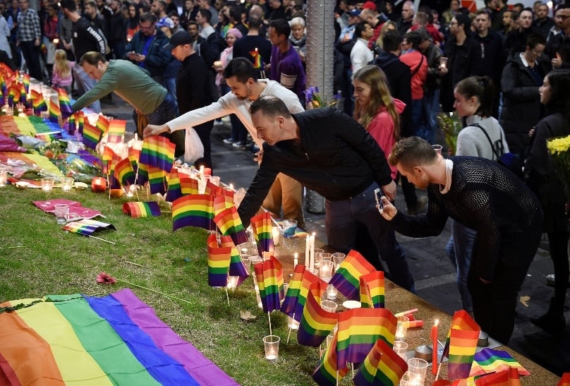 People gather at a vigil in Sydney on 13 June in solidarity for the victims of the Orlando, Florida, gay night club mass shooting. Photo: CNS/Dan Himbrechts via Reuters