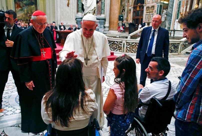 Pope Francis blesses a woman as he meets the disabled during the opening of the diocese of Rome's annual pastoral conference at the Basilica of St John Lateran in Rome on 16 June. Photo: CNS/Tony Gentile, Reuters