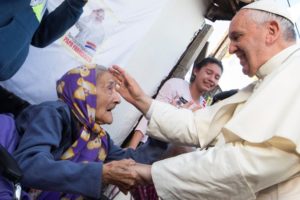 Pope Francis greets an elderly woman as he meets with people in a poor neighbourhood in Asuncion, Paraguay, in this July 2015, file photo. Pastoral care of the poor and those in need has been emphasis of the pontificate of Pope Francis. Photo: CNS/Paul Haring