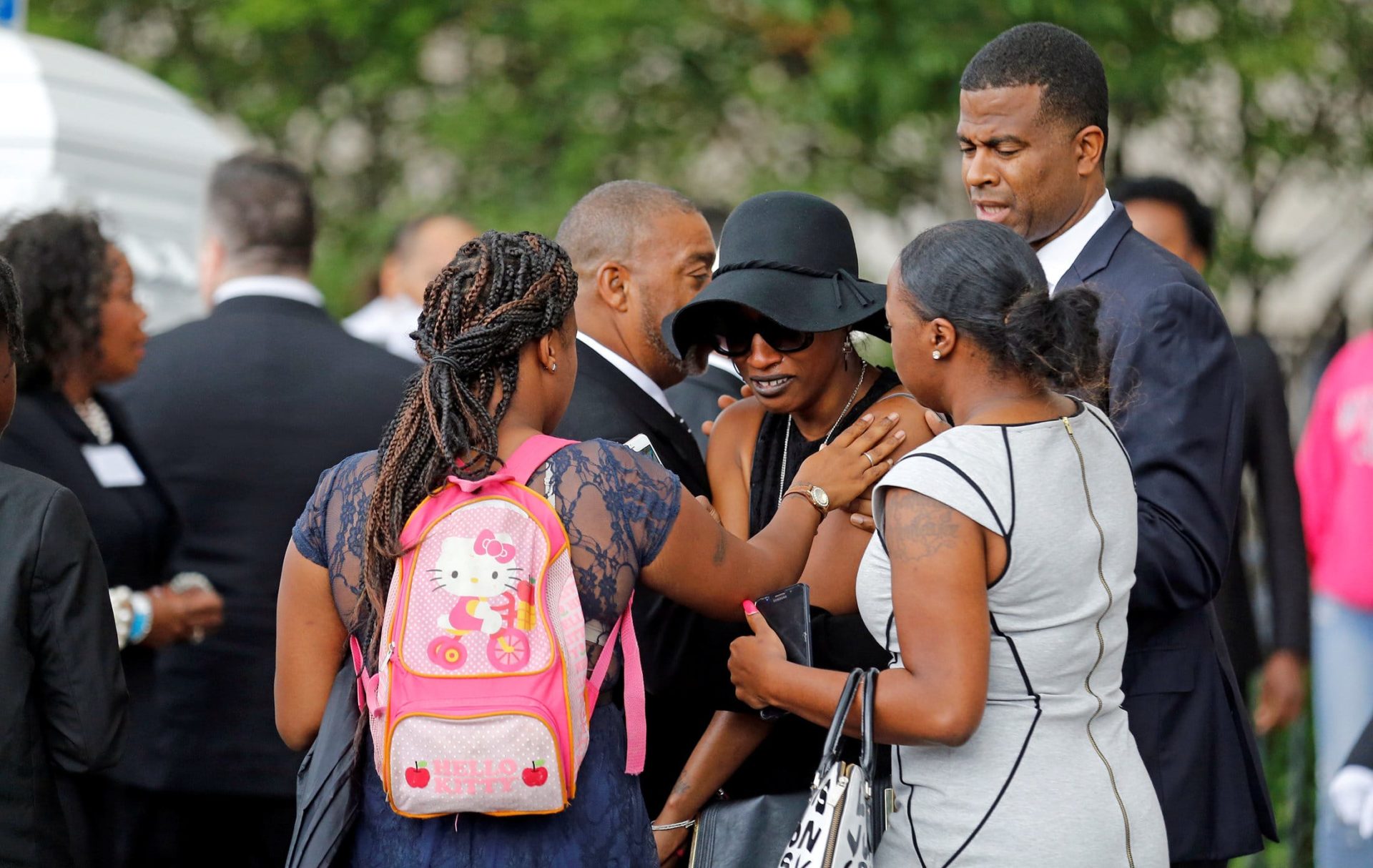 Family members comfort Diamond Reynolds, the girlfriend of  Philando Castile, as his casket arrives for a funeral service at the Cathedral of St Paul in St Paul, Minnesota. Church officials said the mother of 32-year-old man, who was not Catholic, requested the cathedral hold an ecumenical service for her son. Castile was shot and killed by a police officer July 6. (CNS photo/Eric Miller, Reuters) See SHOOTINGS-NBCC-PRAYER-ACTION and CHAPLAINS-FEAR-SUMMER July 14, 2016.