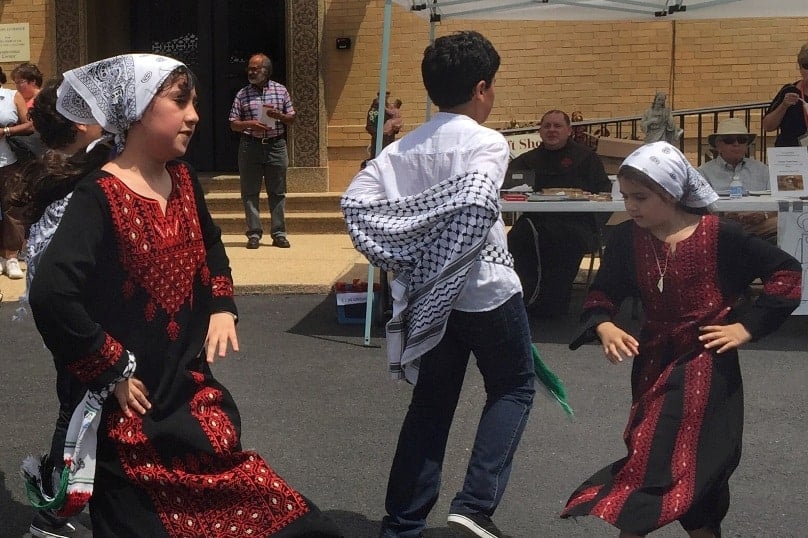 Children from the Kufiyah Dabke Troupe dance at the Franciscan Monastery of the Holy Land in Washington on 16 July. The monastery was the setting of the Holy Land Festival, which seeks to highlight the plight, but also the beauty, of the culture of Palestinians in the Holy Land. Photo: CNS/Rhina Guidos