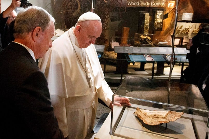 During his visit to the National September 11 Memorial and Museum in New York on in September 2015, Pope Francis looks at a Bible fragment found in the rubble following the 2001 terrorist attack in lower Manhattan. Photo: CNS/Paul Haring