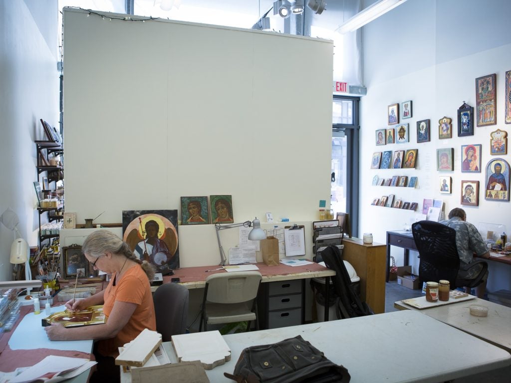 Colette Kalvesmaki works on an icon in her art studio in Washington. Photo: CNS/Tyler Orsburn