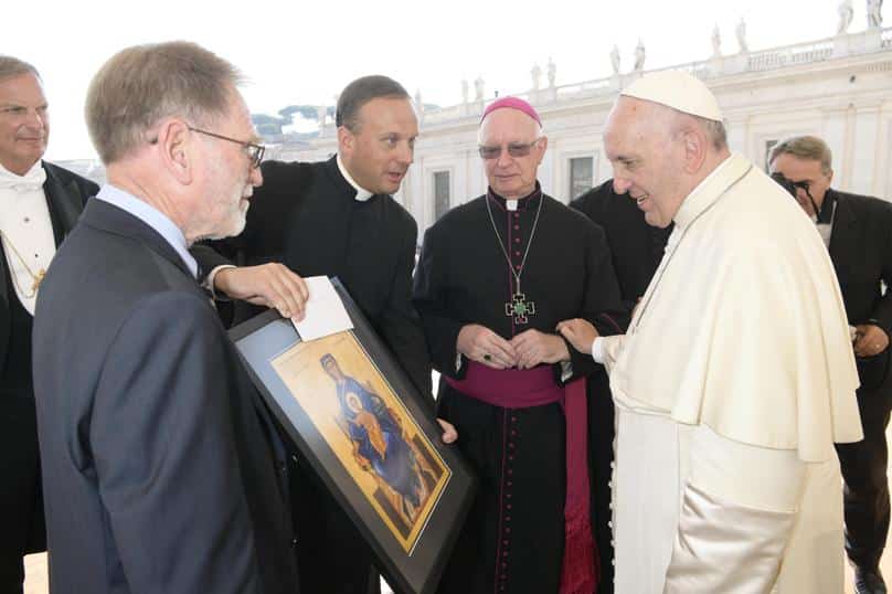 Mons Harry Entwistle, shares a moment with Pope Francis as a copy of the ordinariate’s icon, Our Lady of the Southern Cross, is presented to the pontiff. Photo: L’Osservatore Romano
