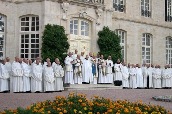Monks from the Abbey of St Joseph de Clairval, above, pose outside the main entrance of their monastic quarters.