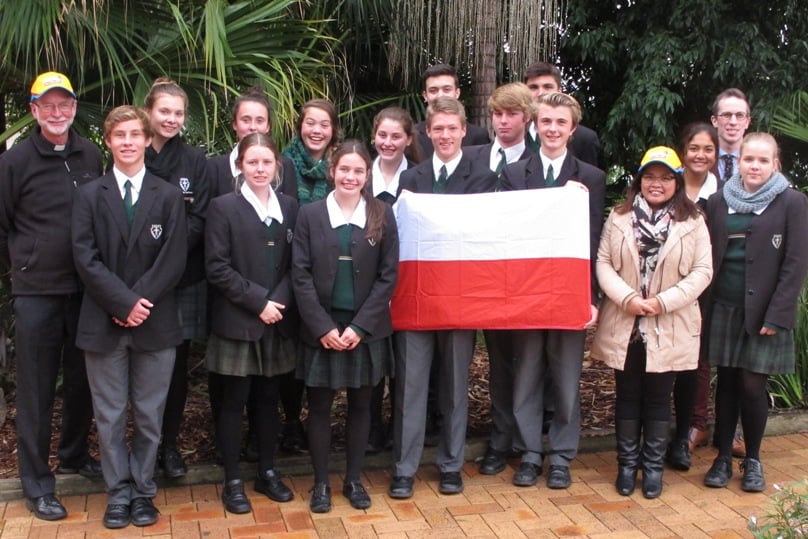 Kasia Slowikowski with fellow St John Bosco College pilgrims, chaplain Fr Peter Carroll SDB (left) and 