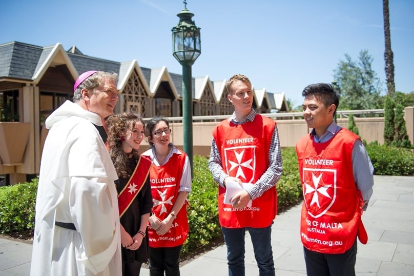 Archbishop Fisher OP met members of the Young Order of Malta at the annual Lourdes Day Mass at St Mary's Cathedral, one of his first cathedral Masses since being installed. Photo: Giovanni Portelli