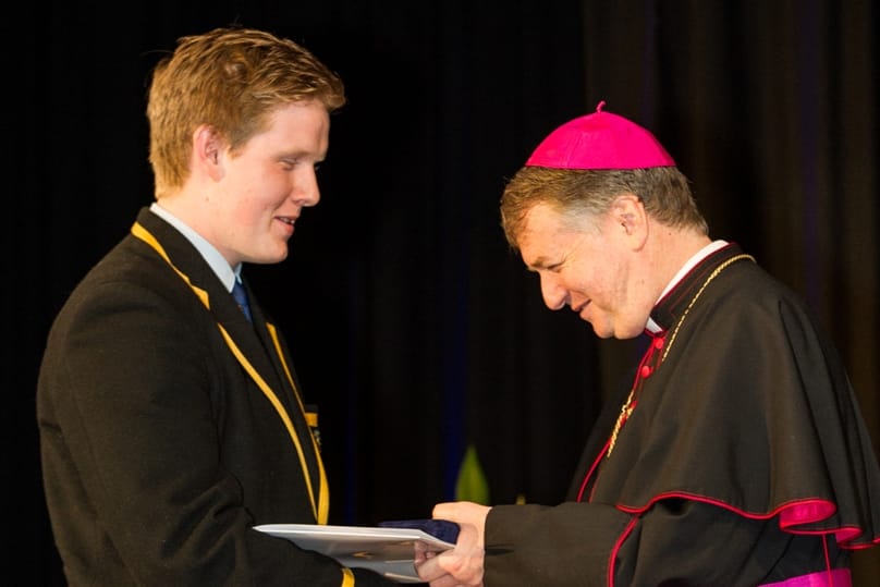 Samuel Hodson receives his award from Archbishop Anthony Fisher OP. Photo: Giovanni Portelli