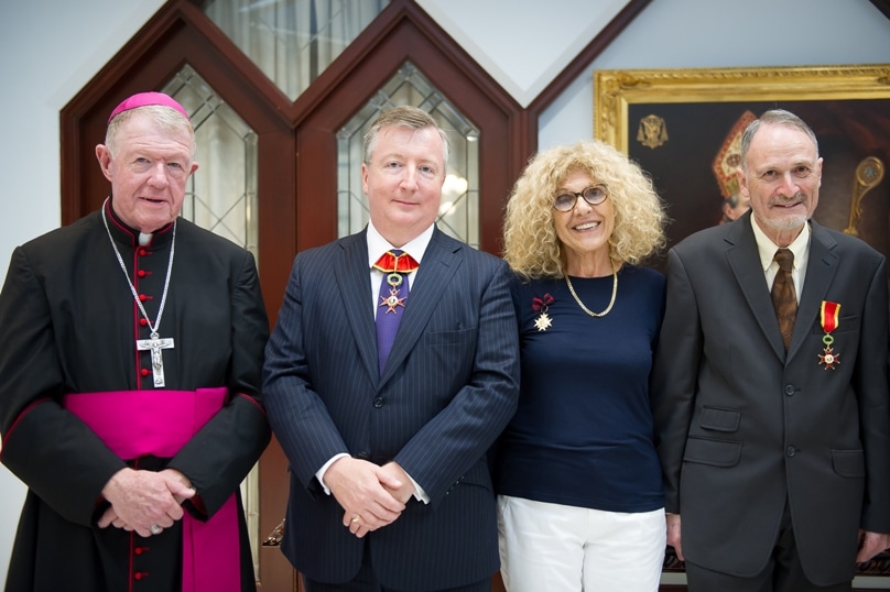 Bishop Terry Brady at Cathedral House with papal honour recipients (from left) Justice Francois Kunc, Gemile Mellick and Neville Moses. Photo: Giovanni Portelli