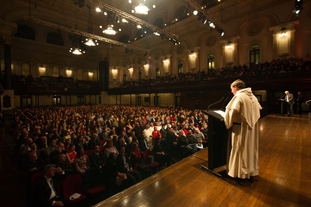 The Archbishop of Sydney, Archbishop Anthony Fisher OP, and Prof Peter Singer face the audience at the Sydney Town Hall debate on the legalisation of voluntary euthanasia.  Photo: Giovanni Portelli