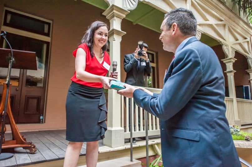 The St Thomas More Society's Clare Bonner presents Lyle Shelton, director of the Australian Christian Lobby, with a gift on 22 November. Photo: Giovanni Portelli 