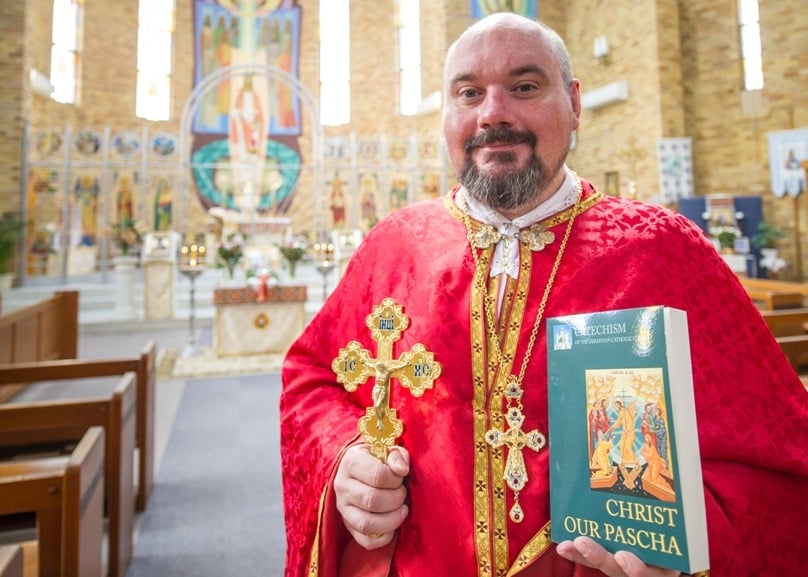Fr Simon Ckuj pictured with a copy of <i>Christ Our Pascha</i> will be launched in Sydney on 5 October. Photo: Giovanni Portelli Ukrainian Catholic Catechism