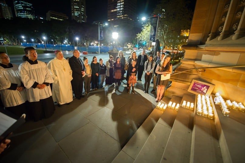 A total of 82 candles were arranged in the shape of a cross on the steps of St Mary’s Cathedral after the Memorial Mass for the Unborn. Photo: Giovanni Portelli